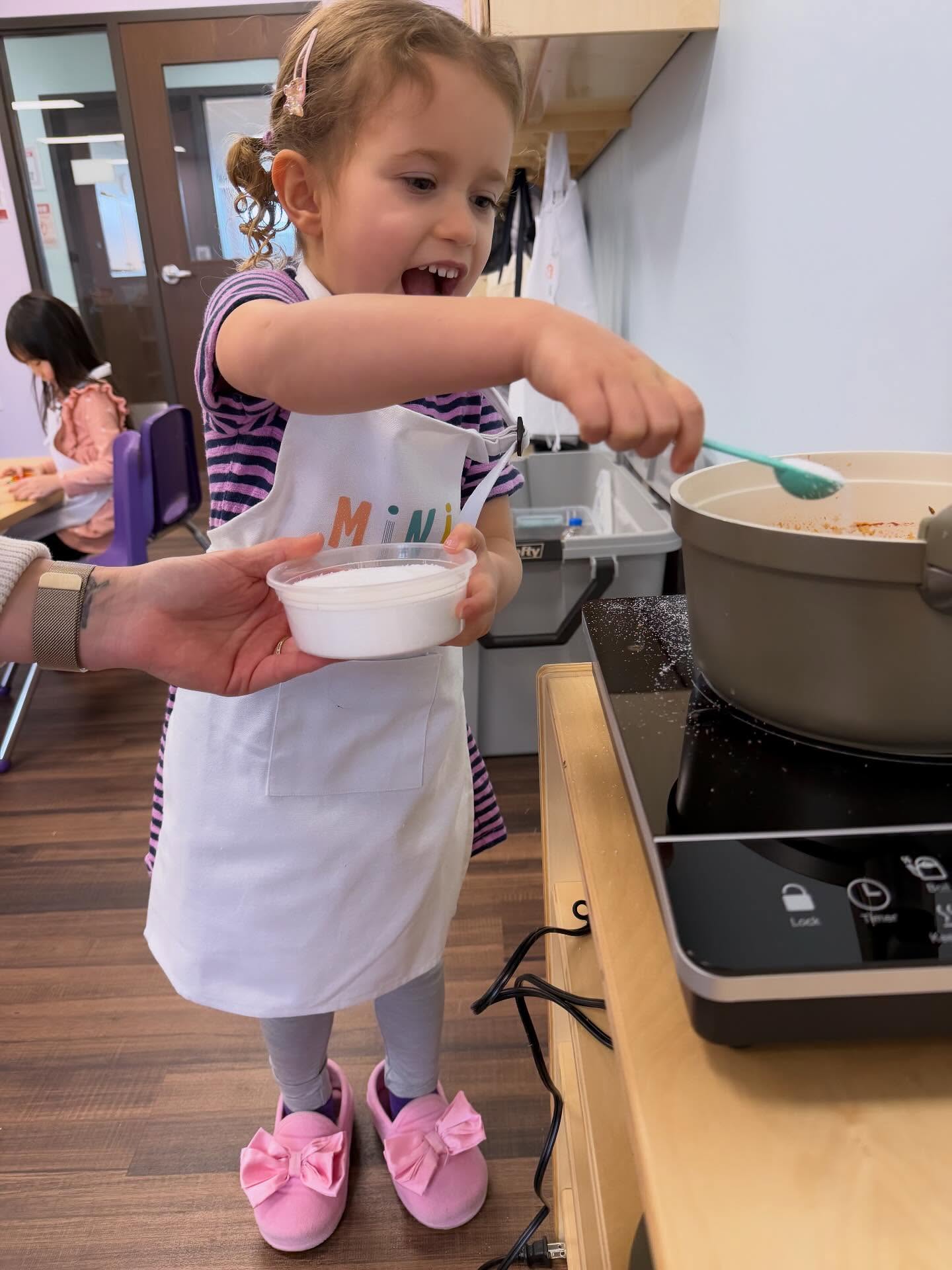 Indian Butter Chickpeas are on the menu at preschools this week! Lots of talk about being safe around hot pots (using our long arms to put ingredients in, only being near the pot with a grown up around). We are also using our noses to smell all the ingredients before they go in: garlic, ginger, garam masala, coriander, cumin, cilantro. And preschoolers always love tearing fresh herbs into “confetti” to garnish their food.